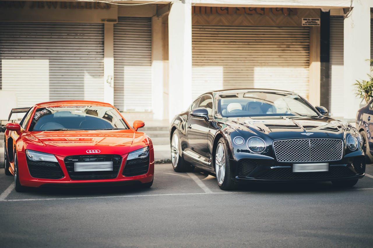 Audi R8 and Bentley Continental GT showcased in a Chandigarh parking area, capturing luxury car elegance.